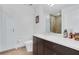 Modern bathroom featuring a sleek vanity, spacious shower with glass door, and neutral color palette at 3325 Piedmont Ne Rd # 2702, Atlanta, GA 30305
