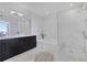 Sleek bathroom featuring a glass-enclosed shower, soaking tub, and modern fixtures, designed for relaxation at 3325 Piedmont Ne Rd # 2702, Atlanta, GA 30305