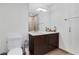 Bathroom featuring a modern vanity, sleek lighting, an oversized mirror, and glass shower doors at 3325 Piedmont Ne Rd # 2702, Atlanta, GA 30305