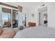 Inviting bedroom with access to a private balcony, showcasing modern decor and a calming color palette at 3325 Piedmont Ne Rd # 2702, Atlanta, GA 30305