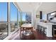 Light-filled dining area featuring modern furnishings, floor-to-ceiling windows, and an open view of the kitchen at 3325 Piedmont Ne Rd # 2702, Atlanta, GA 30305