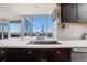 Modern kitchen featuring stainless steel appliances, subway tile backsplash, and large windows with a city view at 3325 Piedmont Ne Rd # 2702, Atlanta, GA 30305