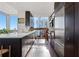 Sleek, modern kitchen featuring stainless steel appliances, dark cabinetry, and a light countertop with city views at 3325 Piedmont Ne Rd # 2702, Atlanta, GA 30305