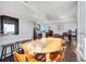 Wide shot of an open living area showcasing hardwood floors, large dining table, and access to a kitchen at 3325 Piedmont Ne Rd # 2702, Atlanta, GA 30305