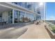 Spacious outdoor patio with glass windows, barbecue grill, and outdoor dining space at 3325 Piedmont Ne Rd # 2702, Atlanta, GA 30305