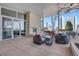 Elegant outdoor patio featuring wicker seating, a stone fireplace, and stunning city views at 3325 Piedmont Ne Rd # 2702, Atlanta, GA 30305