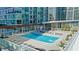 Beautiful pool area with plenty of lounge chairs, lush landscaping, and clear blue water at 3325 Piedmont Ne Rd # 2702, Atlanta, GA 30305