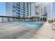 Beautiful swimming pool surrounded by lounge chairs and a covered pergola at 3325 Piedmont Ne Rd # 2702, Atlanta, GA 30305