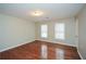 Bright bedroom with hardwood floors and neutral walls at 658 Wolfs Bane Nw Dr, Acworth, GA 30102