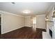 Bright living room featuring hardwood floors and a fireplace at 658 Wolfs Bane Nw Dr, Acworth, GA 30102