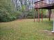 Large backyard with elevated deck and mature trees at 1119 Oakwood Manor Ct, Decatur, GA 30032