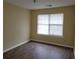 Simple bedroom with hardwood floors and window at 1119 Oakwood Manor Ct, Decatur, GA 30032