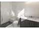 Bathroom with white subway tile shower and gray vanity at 122 Owens Mill Pl, Canton, GA 30115