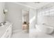 Bright bathroom featuring a freestanding tub and marble tile at 122 Owens Mill Pl, Canton, GA 30115