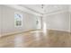Large bedroom with hardwood floors and ceiling fan at 122 Owens Mill Pl, Canton, GA 30115