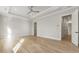 Spacious bedroom with hardwood floors and ensuite bath access at 122 Owens Mill Pl, Canton, GA 30115