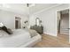 Spacious bedroom with hardwood floors and ensuite bathroom access at 122 Owens Mill Pl, Canton, GA 30115