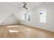 A bright, spacious bedroom featuring hardwood floors, a ceiling fan, and a large window at 122 Owens Mill Pl, Canton, GA 30115