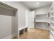 Large walk-in closet with bench and ample storage at 122 Owens Mill Pl, Canton, GA 30115