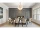 Formal dining room with chandelier, modern table and neutral decor at 122 Owens Mill Pl, Canton, GA 30115