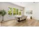 Bright dining room with hardwood floors, large windows, and an elegant chandelier at 122 Owens Mill Pl, Canton, GA 30115