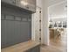 Gray entryway with built-in bench, hooks, and view of kitchen at 122 Owens Mill Pl, Canton, GA 30115