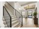 Grand entryway with hardwood floors and modern staircase at 122 Owens Mill Pl, Canton, GA 30115