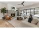 Cozy Gathering room featuring a stone fireplace and large windows at 122 Owens Mill Pl, Canton, GA 30115