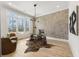 Modern home office with glass desk, herringbone wall, and hardwood floors at 122 Owens Mill Pl, Canton, GA 30115