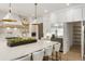 Bright kitchen boasts white cabinets, a spacious island, and a walk-in pantry at 122 Owens Mill Pl, Canton, GA 30115