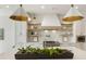 Stylish kitchen features a large island, white cabinets, and gold accents at 122 Owens Mill Pl, Canton, GA 30115