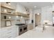 Modern kitchen with double oven, white cabinetry, and a quartz countertop at 122 Owens Mill Pl, Canton, GA 30115