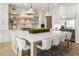 Gourmet kitchen features a large island, white cabinets, and modern lighting at 122 Owens Mill Pl, Canton, GA 30115