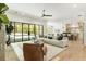Open living space with a view of the pool, kitchen, and hardwood floors at 122 Owens Mill Pl, Canton, GA 30115