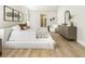 Spacious main bedroom with light walls, and hardwood floors at 122 Owens Mill Pl, Canton, GA 30115