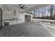 Outdoor kitchen with stainless steel appliances and stone flooring at 122 Owens Mill Pl, Canton, GA 30115
