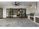 Outdoor patio with black framed doors opening to the living room and an outdoor kitchen at 122 Owens Mill Pl, Canton, GA 30115