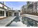 Luxury home with inviting pool, expansive patio, and outdoor kitchen at 122 Owens Mill Pl, Canton, GA 30115
