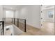 Bright upstairs hall with hardwood floors and modern railing at 122 Owens Mill Pl, Canton, GA 30115