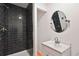 Modern bathroom with dark tile shower and vanity at 1512 Flat Shoals Rd, Atlanta, GA 30349