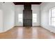 Living room with hardwood floors and a large fireplace at 1512 Flat Shoals Rd, Atlanta, GA 30349