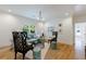 Bright living room features hardwood floors, a light green sofa, and two black accent chairs at 2717 Skyland Dr, Brookhaven, GA 30319