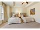 Bright bedroom with two twin beds and ceiling fan at 3276 Ferncliff Ln, Atlanta, GA 30324