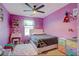 Charming bedroom with colorful decor and a ceiling fan at 359 Hiawassee Dr, Woodstock, GA 30188