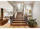 Modern wooden staircase leading down to the basement at 211 N Esplanade, Alpharetta, GA 30009