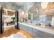 Elegant bathroom with a large vanity and blue marble tile at 211 N Esplanade, Alpharetta, GA 30009