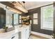 Elegant bathroom with a white vanity and dark gray walls at 211 N Esplanade, Alpharetta, GA 30009