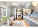 Luxurious bathroom with a soaking tub, walk-in shower, and modern vanity at 211 N Esplanade, Alpharetta, GA 30009
