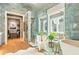 Modern bathroom with a walk-in shower, soaking tub, and stylish fixtures at 211 N Esplanade, Alpharetta, GA 30009