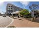 Modern Avalon building exterior with retail spaces on the ground floor at 211 N Esplanade, Alpharetta, GA 30009